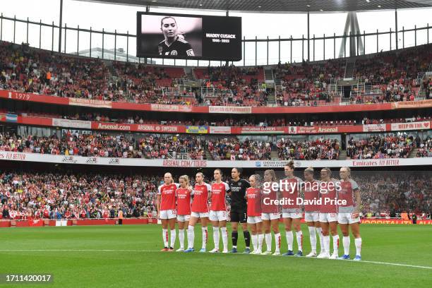 Arsenal players observe a minute of silence in tribute to Maddy Cusack, prior to the Barclays Women's Super League match between Arsenal FC and...