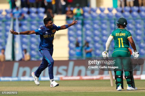 Sri Lanka's Dilshan Madushanka celebrates the wicket of South Africa's captain Temba Bavuma during the ICC Men's Cricket World Cup 2023 match between...