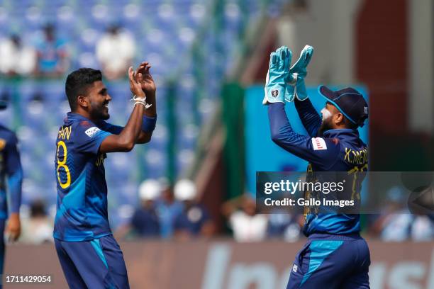 Sri Lanka's Dilshan Madushanka celebrates the wicket of South Africa's captain Temba Bavuma during the ICC Men's Cricket World Cup 2023 match between...