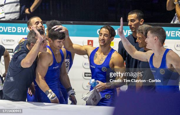 October 01: Yumin Abbadini of Italy is congratulated by teammates after securing his side a spot in the team final and a place in the Olympic Games...