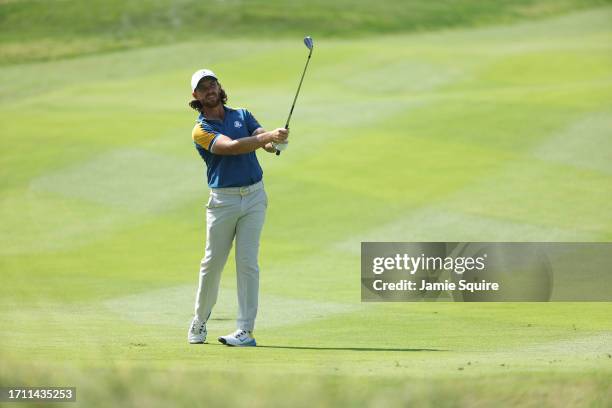 Tommy Fleetwood of Team Europe plays his second shot on the first hole during the Sunday singles matches of the 2023 Ryder Cup at Marco Simone Golf...