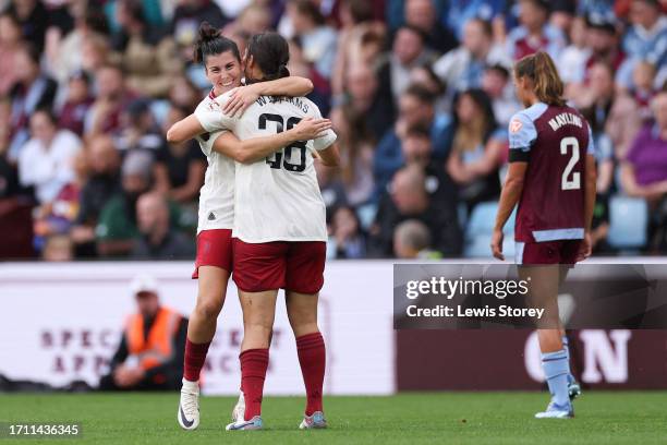 Rachel Williams of Manchester United celebrates with teammate Lucia Garcia after scoring the team's second goal during the Barclays Women's Super...