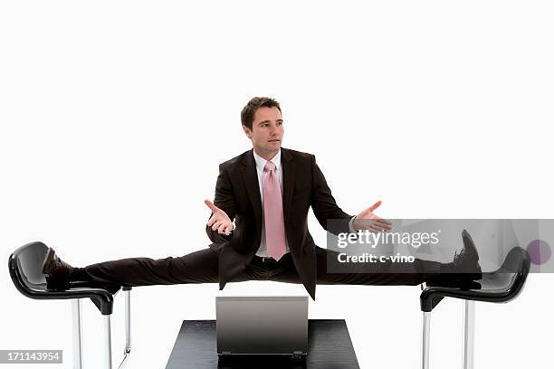 manager is caught between two chairs - doing the splits stock pictures, royalty-free photos & images