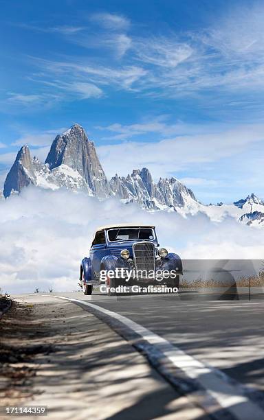 blue sky over antique car driving in patagonia argentina - hot rod car stock pictures, royalty-free photos & images