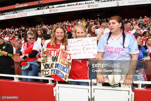 Young fans show their support with signs prior to the Barclays Women's Super League match between Arsenal FC and Liverpool FC at Emirates Stadium on...