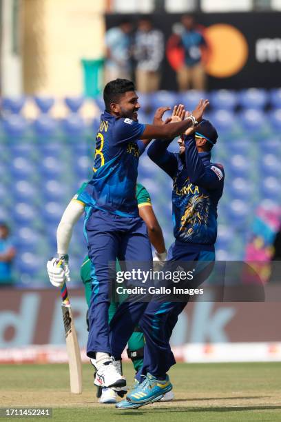 Sri Lanka's Dilshan Madushanka celebrates the wicket of South Africa's captain Temba Bavuma during the ICC Men's Cricket World Cup 2023 match between...