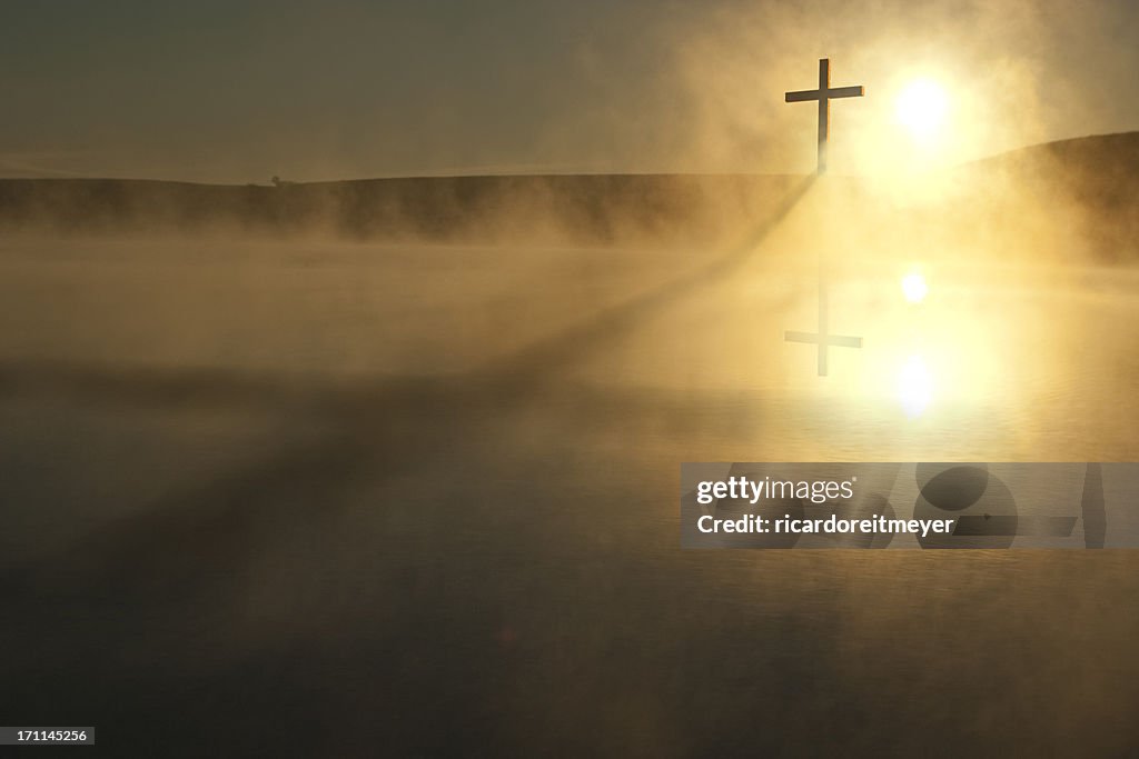 Single Cross Long Shadow Sunrise on Foggy Lake Easter Morning