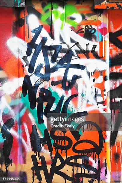 colorful graffiti on a concrete wall. - colourful graffiti stock pictures, royalty-free photos & images