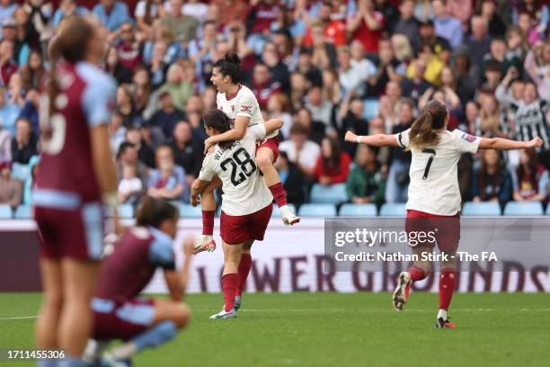 Rachel Williams of Manchester United celebrates with teammate Lucia Garcia after scoring the team's second goal during the Barclays Women's Super...