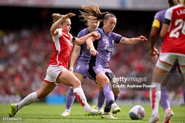 Miri Taylor of Liverpool Women competing with Steph Catley of Arsenal Women during the Barclays Women's Super League match between Arsenal FC and...