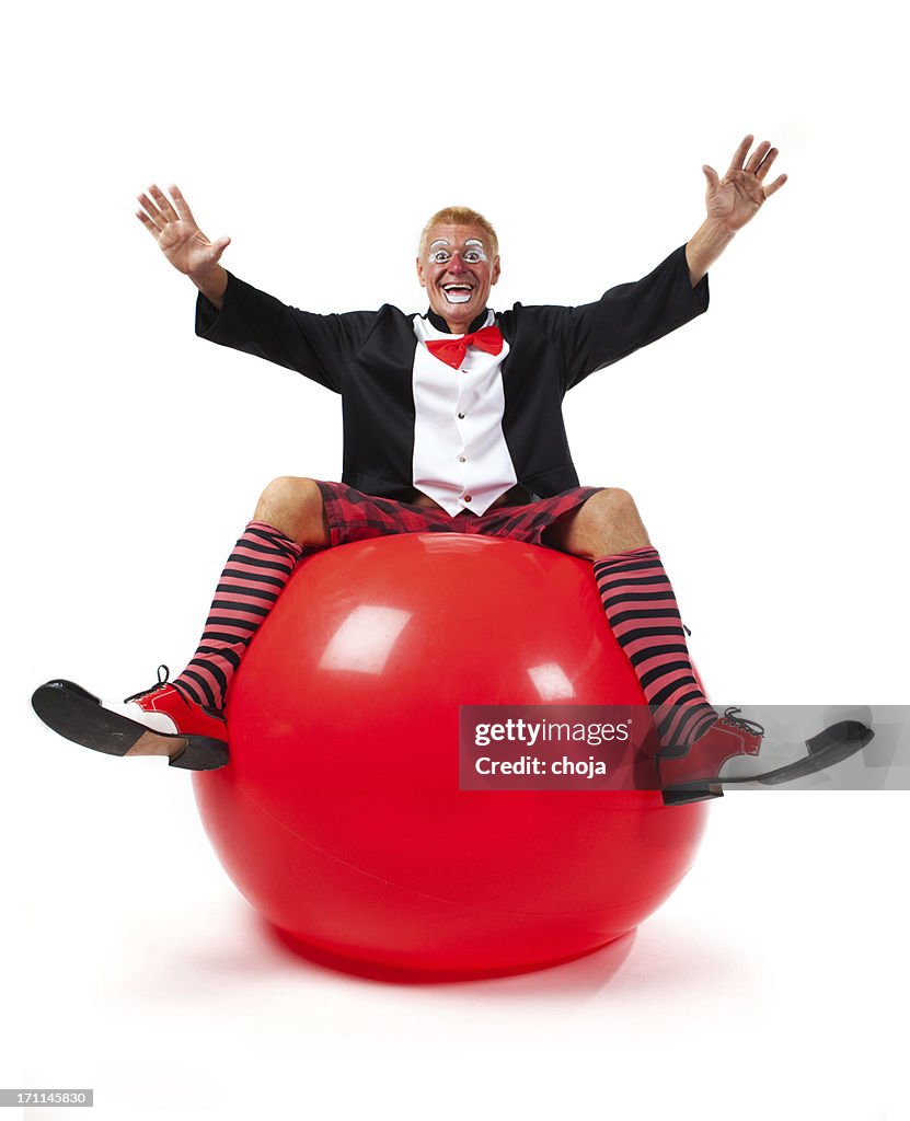 Happy clown on red ball