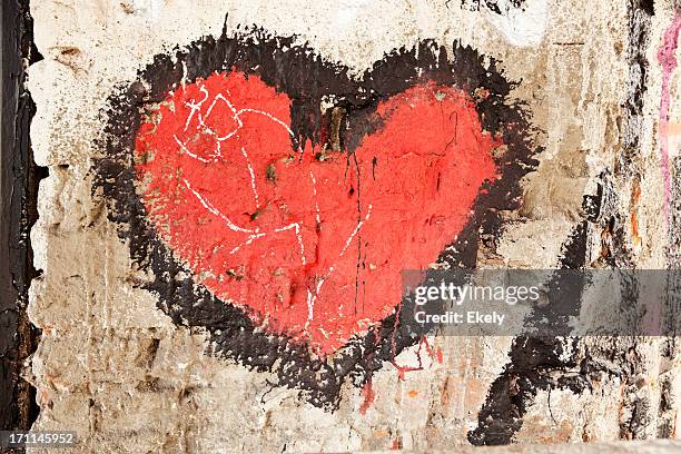 red heart on a wall. - love graffiti stock pictures, royalty-free photos & images