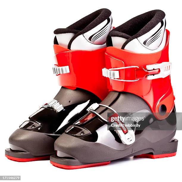 ski boots for juniors, isolated on white background - skischoen stockfoto's en -beelden