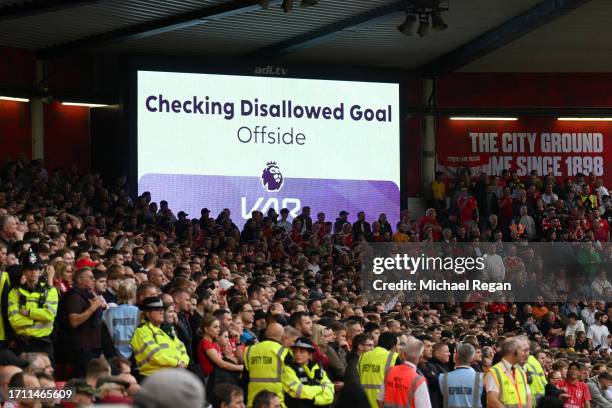 The LED screen shows that VAR is checking for an offside goal scored by Taiwo Awoniyi of Nottingham Forest which is later ruled offside during the...