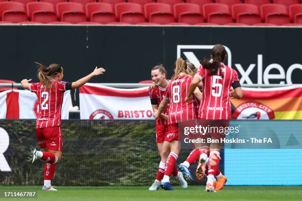 Carrie Jones of Bristol City celebrates with teammates after scoring the team's first goal during the Barclays Women's Super League match between...