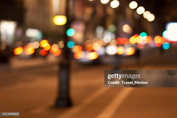 defocused city street lights background in paris, france - city street night background stock pictures, royalty-free photos & images