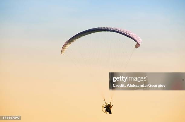 paraglider moving with propeller - motor paraglider stock pictures, royalty-free photos & images