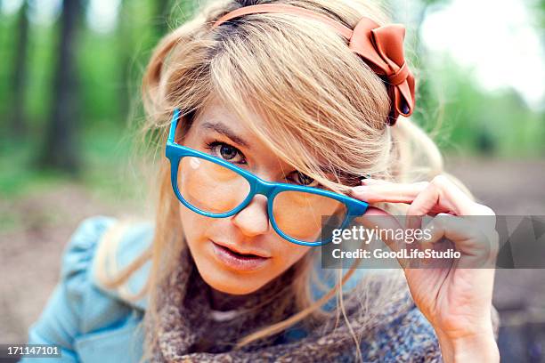 retro girl with glasses - granny glasses stockfoto's en -beelden