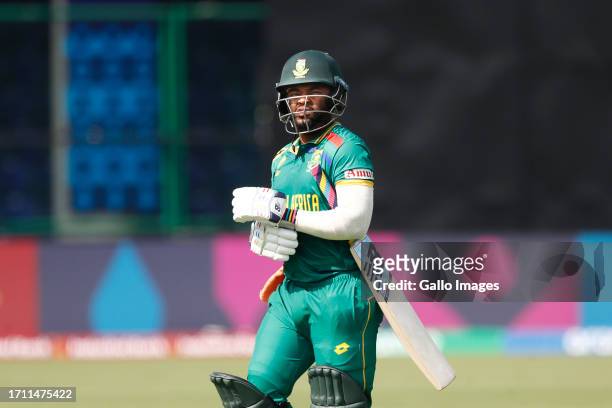 South Africa's captain Temba Bavuma makes their way off after being dismissed during the ICC Men's Cricket World Cup 2023 match between South Africa...