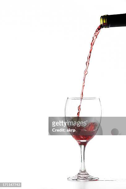 pouring red wine - pouring stock pictures, royalty-free photos & images