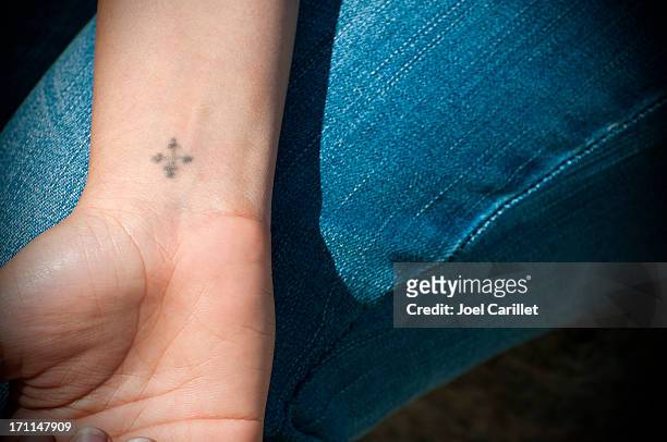 53 Cross Tattoos On Arm Photos and Premium High Res Pictures - Getty Images