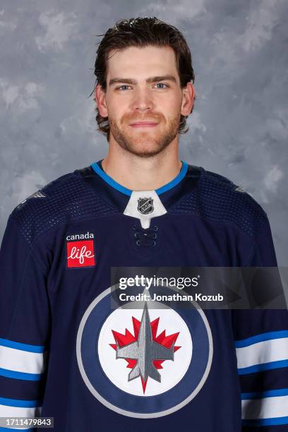 Adam Lowry of the Winnipeg Jets poses for his official headshot for the 2023-2024 season on September 20, 2023 at Hockey For All Centre in Winnipeg,...