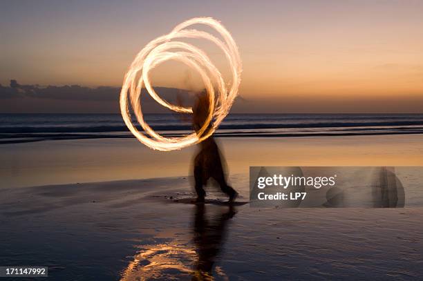 fire show on the beach in bali - fire performer stock pictures, royalty-free photos & images