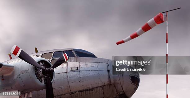 detail of old propeller airplane and windsock - wind sock stock pictures, royalty-free photos & images