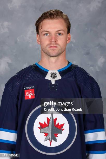 Josh Morrissey of the Winnipeg Jets poses for his official headshot for the 2023-2024 season on September 20, 2023 at Hockey For All Centre in...