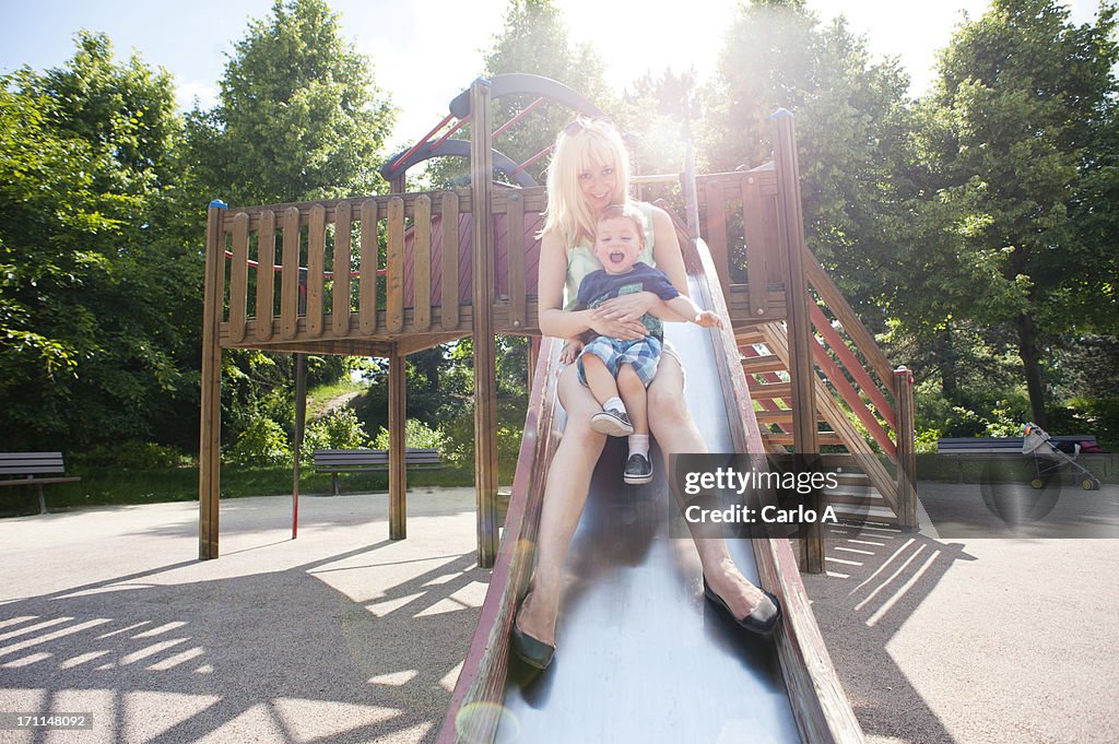 Mom and son sliding