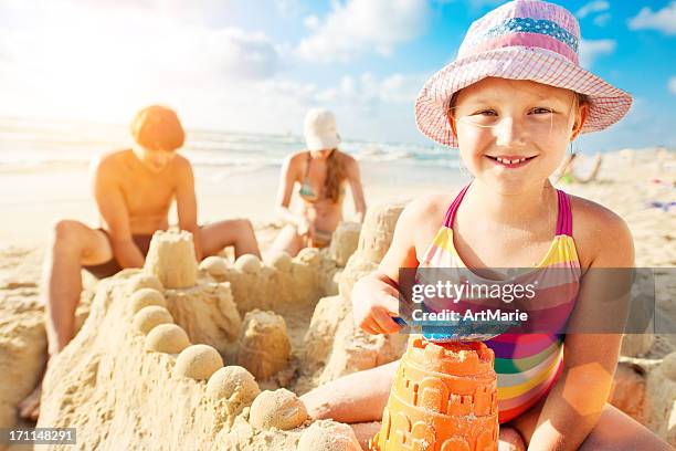 building a sand castle - sand castle bildbanksfoton och bilder