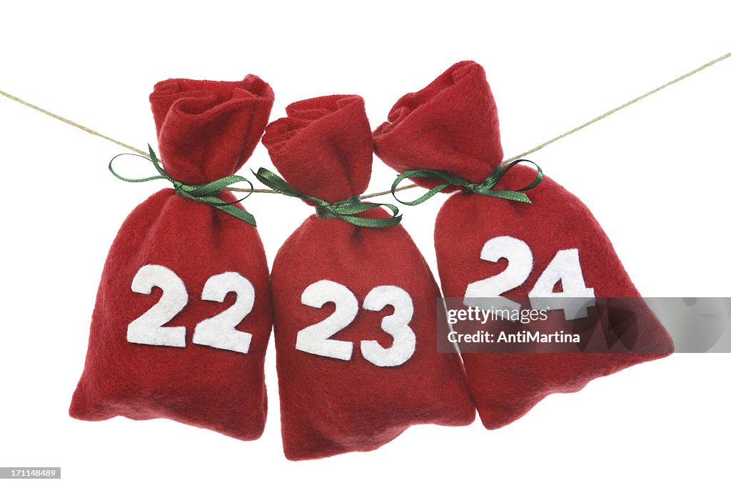 Red Christmas bags for advent calendar on a string