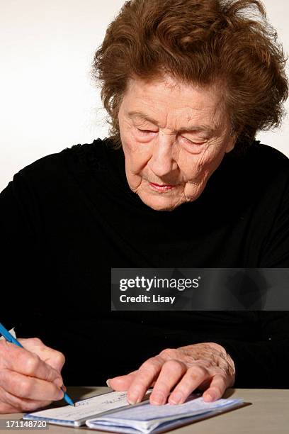 Woman Writecheck 53 Senior Writing A Check Stock Photos, High-Res Pictures, and Images ...