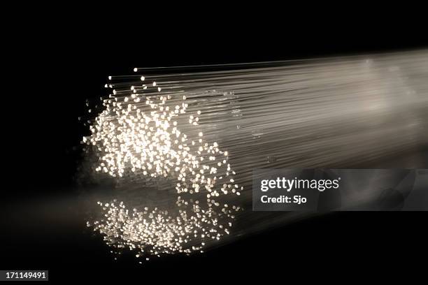 bright fibre light - photon stock pictures, royalty-free photos & images