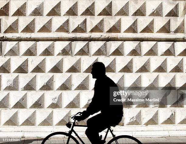 person riding bicycle - ferrara stock pictures, royalty-free photos & images