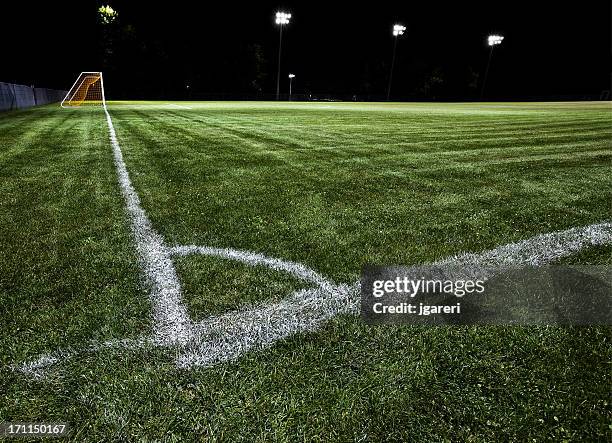 soccer field at night - soccer background stock pictures, royalty-free photos & images