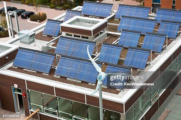 above view of a brown rectangle building with solar panels - energy efficient building stock pictures, royalty-free photos & images