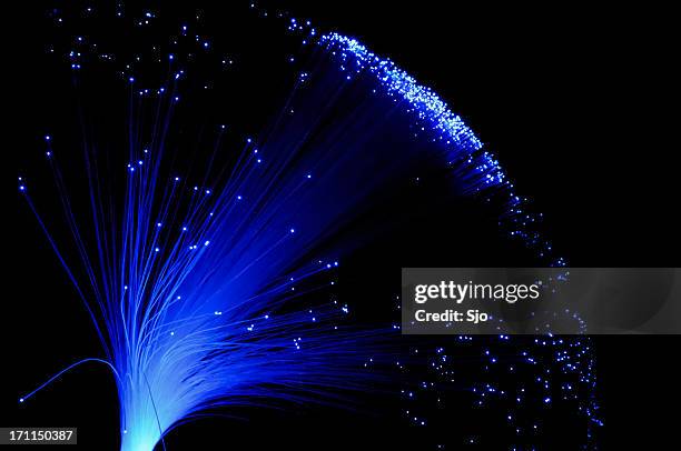 blue fibre light - fibre stock pictures, royalty-free photos & images