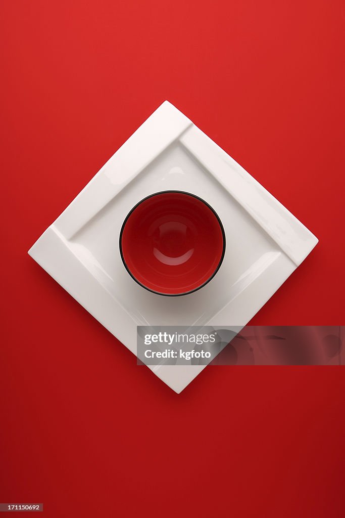 Red circle bowl on white square plate
