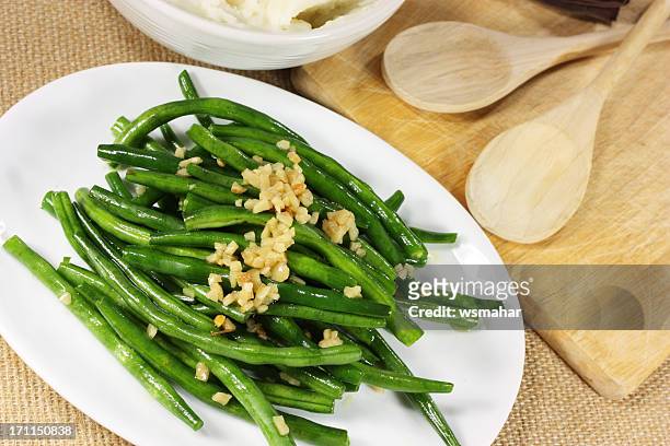 fresh green beans serves with crushed nuts - green bean stockfoto's en -beelden