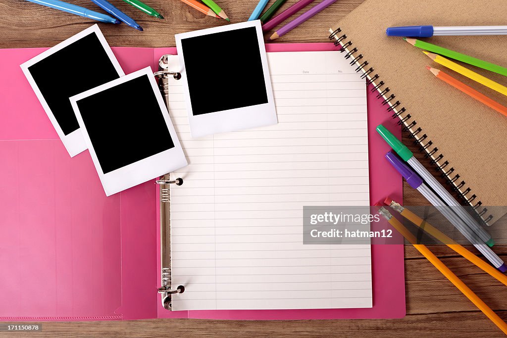 Student's desk with blank photos