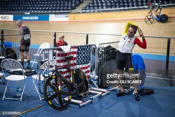 Kurt Sato , of the USA, warms-up as he prepares to compete in the semifinals for the Men's Sprint in the age 65-69 category at the UCI Masters Track...