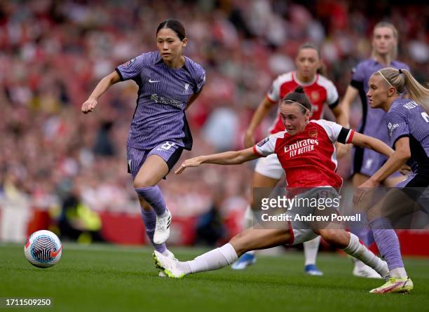 Fuka Nagano and Emma Koivisto of Liverpool Women competing with Caitlin Foord of Arsenal Women during the Barclays Women's Super League match between...