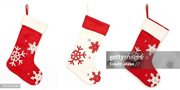 thress christmas stockings with shadow on white background - stockings stockfoto's en -beelden