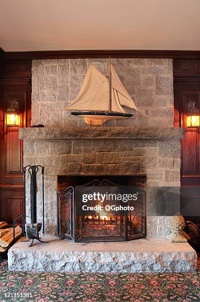 beautiful stone wood burning fireplace - mantel stock pictures, royalty-free photos & images