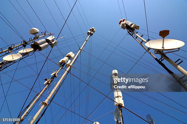 telecommunication masts and satellites seen from below - television aerial stock pictures, royalty-free photos & images