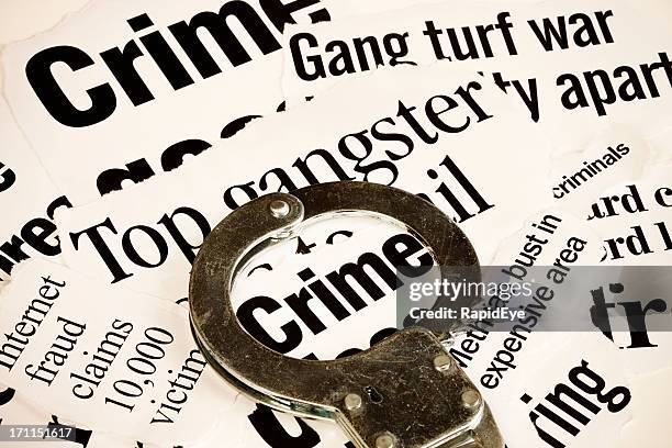 handcuff highlights 'crime' in a series of articles on criminality - newspaper clippings stock pictures, royalty-free photos & images