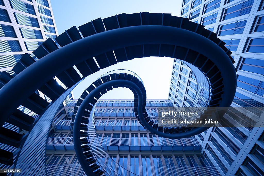 Spiral stiars in front of modern architecture