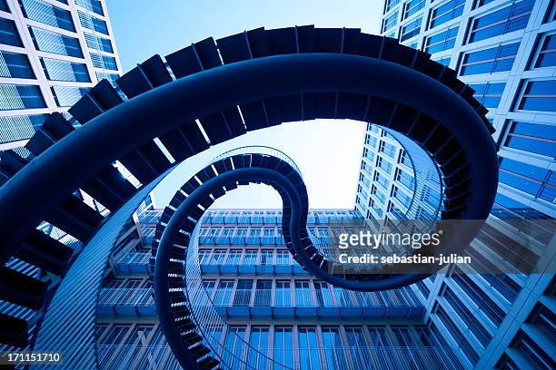 spiral stiars in front of modern architecture - architecture stock pictures, royalty-free photos & images