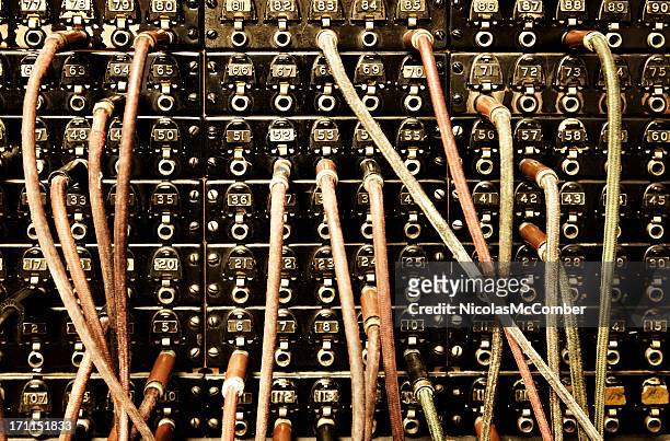 old switchboard with dangling wires - telephone switchboard stock pictures, royalty-free photos & images
